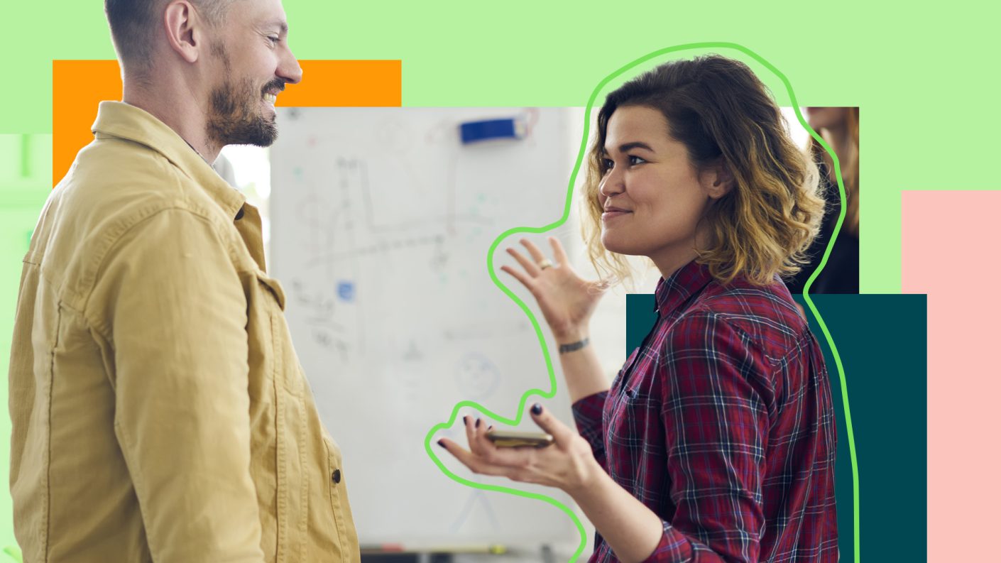 Person explaining something to another person with her hands in the air