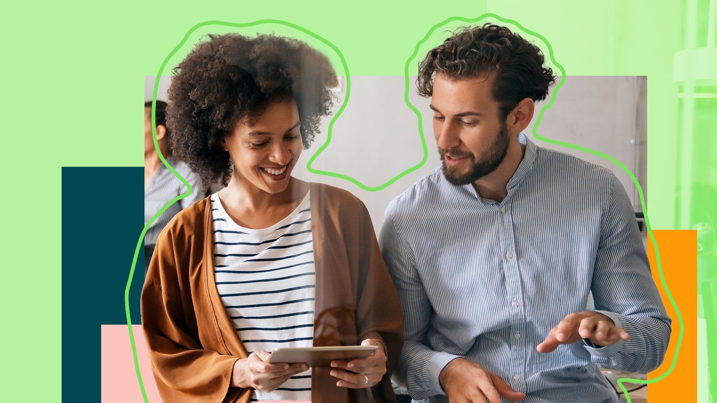 Two people looking at tablet in discusssion