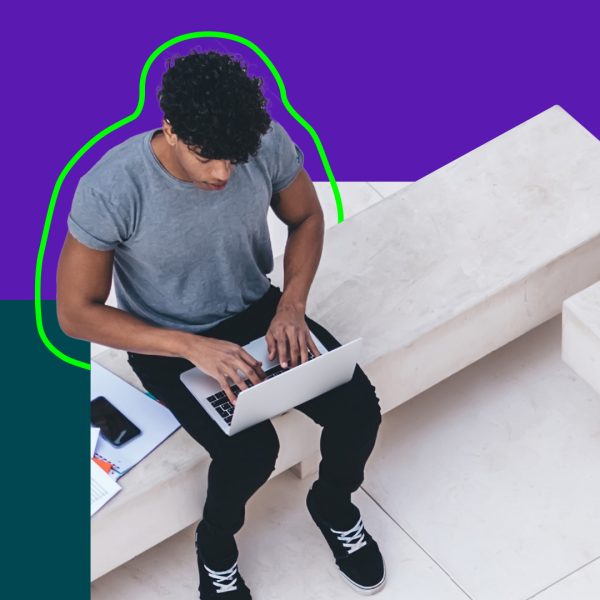 Person seen from above working on laptop