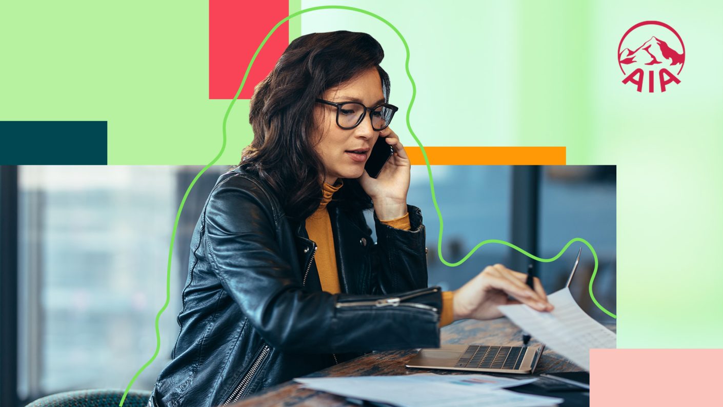 Woman on the phone working at a desk