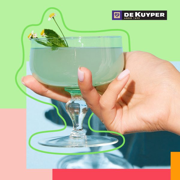 Hand holding a cocktail