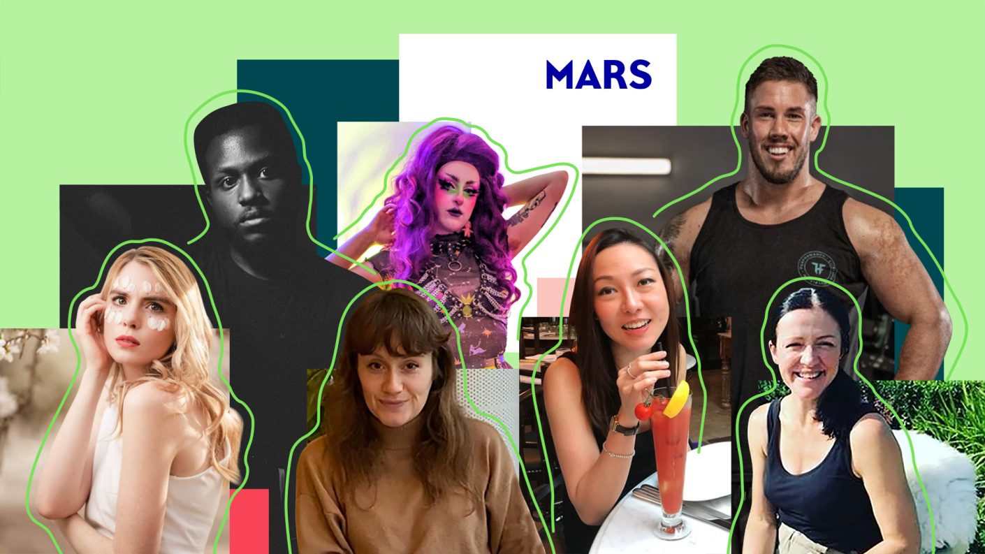 Seven very diverse people looking in the camera