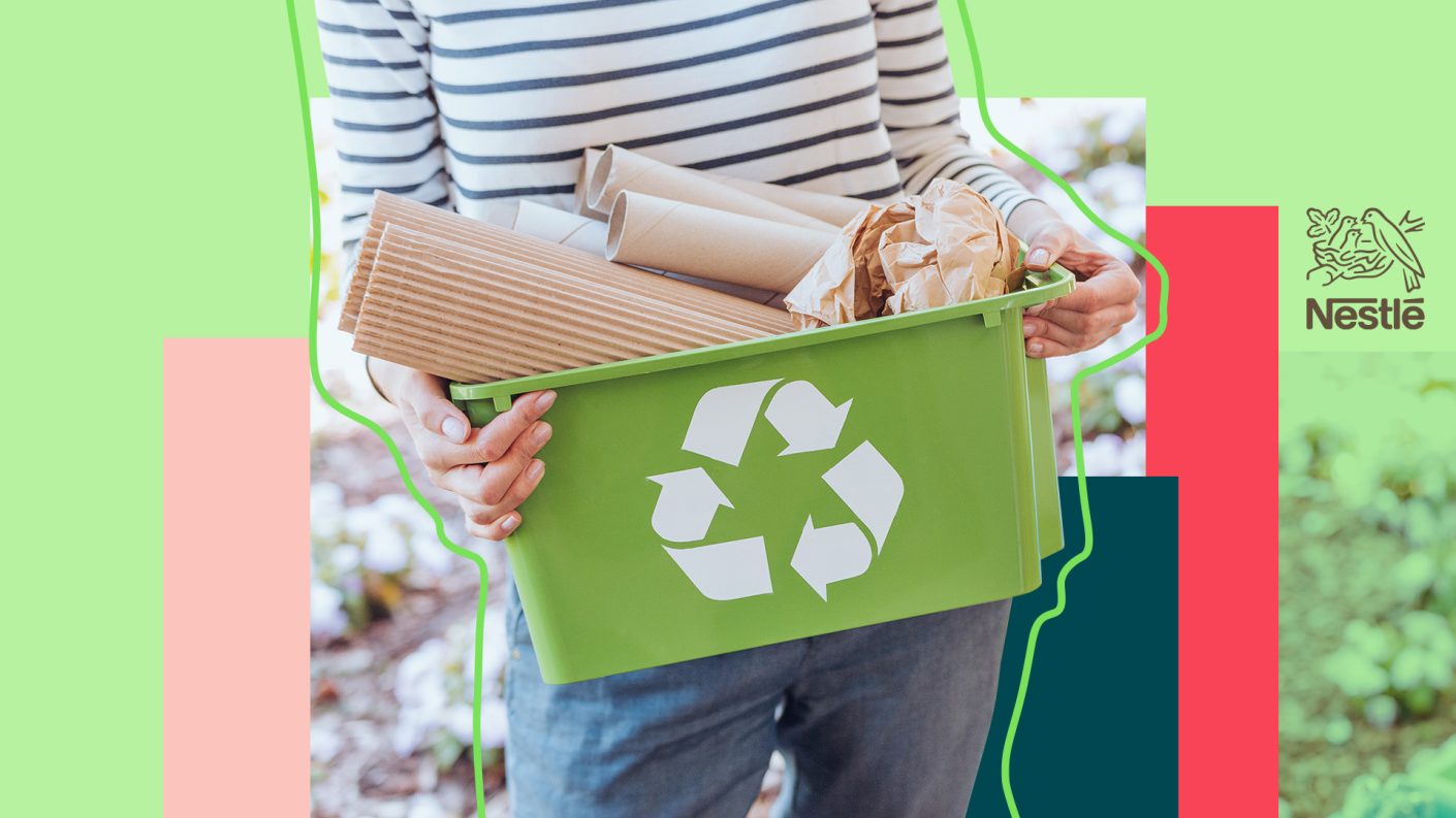 Person holding recycle bin