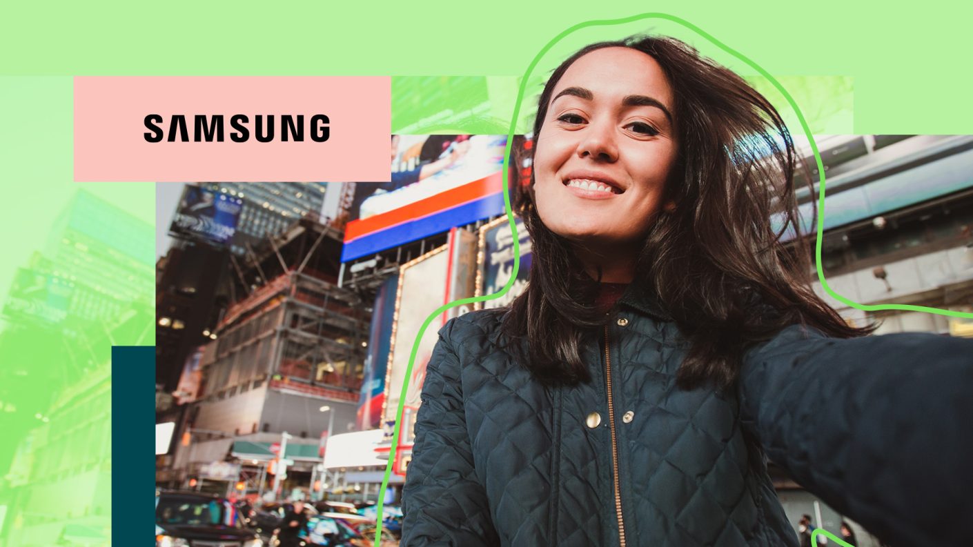 A person in a city taking a selfie