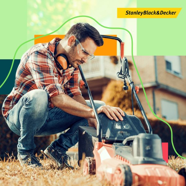Man checking lawn mower