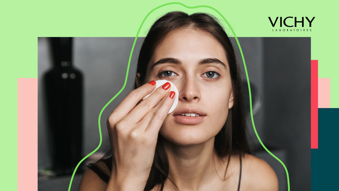 Young woman cleaning face