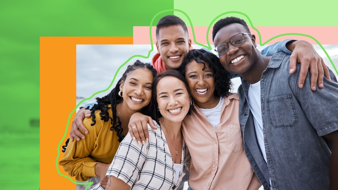 5 people hugging and smiling at the camera